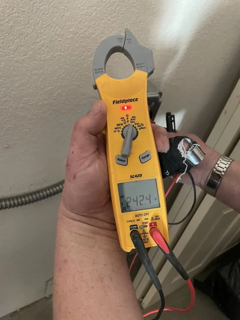 Voltage testing with clamp meter during Recessed Lighting Installation in Stoughton